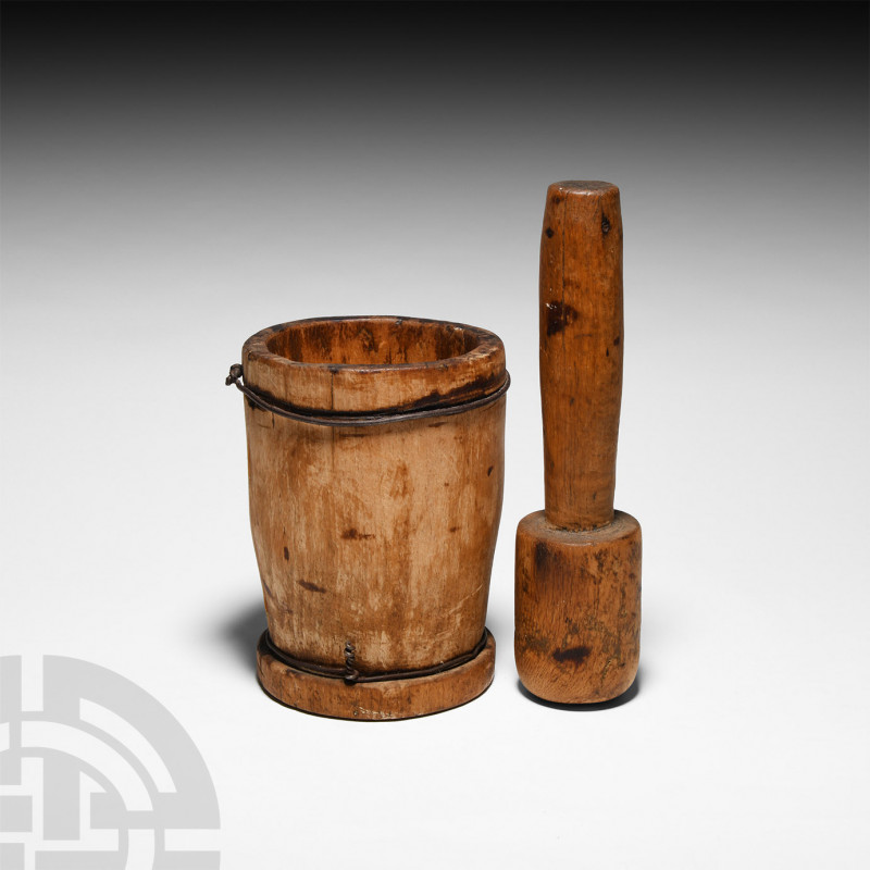 Tribal Spice Mortar and Pestle. 20th century A.D. A wooden pestle and mortar set...