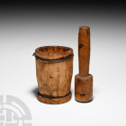 Tribal Spice Mortar and Pestle. 20th century A.D. A wooden pestle and mortar set: the pestle with columnar handle and drum-shaped head; the mortar hol...