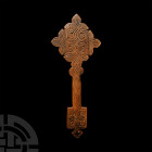 Ethiopian Carved Wooden Hand Cross. 19th-20th century A.D. A bifacial wooden cross with engraved interlace borders and stylised flowers. 88 grams, 25....