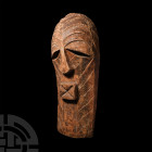 Kenyan Kamba Tribal Mask. 20th century A.D. A carved wooden mask, leaf-shaped in plan with reserved nose and mouth, angled elliptical slots to the eye...