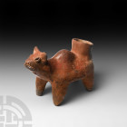 Prehispanic Protoclassic Terracotta Dog Vessel. 100 B.C.-250 A.D. A Colima culture terracotta vessel formed in the round as a stylised dog standing on...