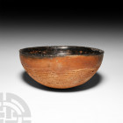 Prehispanic Bowl with Stippled Exterior. New Mexico, Arizona Region, 1000-1200 A.D. A terracotta bowl with hemispherical profile and rounded base, the...