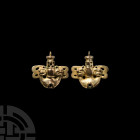 Prehispanic Aztec Gold Earrings. c.15th century A.D. A matched pair of bifacial gold earrings, each composed of a crescentic lower body with pierced c...