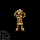 South American Gold Figural Amulet. 19th-20th century A.D. A figural amulet in the form of a standing male figure with hands clasping his head, detail...