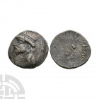 Kings of Elymais - Kamnaskires III - Portrait AR Tetradrachm. 62-46 B.C. Obv: profile bust left with Seleukid anchor behind. Rev: small profile bust l...