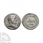 Maximian - Wreath AR Argenteus. 300 A.D. Aquileia mint. Obv: MAXIMIANVS AVG legend with laureate head right. Rev: XCVI / AQ in two lines within wreath...