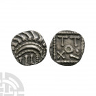 Continental Issues - Series E - Standard AR Sceatta. 695-740 A.D. Obv: degraded head right. Rev: standard with TOTII within. S. 790; N. 45. 0.93 grams...