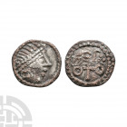 Primary Phase - Series BIIIA - Bird on Cross AR Sceatta. 680-710 A.D. Obv: profile bust right. Rev: bird right on cross with pellet quatrefoil before ...