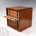 Vintage Mahogany Coin Cabinet. 20th century A.D. A substantial mahogany coin cabinet with twenty-eight double-pierced trays with foam inserts for coin...