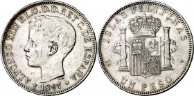 1897. Alfonso XIII. Manila. SGV. 1 peso. (AC. 122). Golpecitos. 24,96 g. MBC-.
