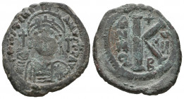 Byzantine
Justinian I. AD 527-565. AE Half Follis.

Weight: 9,7 gr
Diameter: 26,9 mm