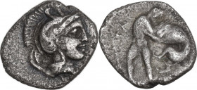 Greek Italy. Southern Apulia, Tarentum. AR Diobol, c. 380-325 BC. Obv. Helmeted head of Athena right, helmet decorated with hippocamp. Rev. TA. Herakl...