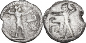 Greek Italy. Bruttium, Kaulonia. AR Third Nomos-Drachm, c. 500-480 BC. Obv. Apollo advancing right, holding branch in right hand, left arm extended, u...