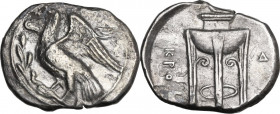 Greek Italy. Bruttium, Kroton. AR Nomos, c. 350-300 BC. Obv. Eagle standing left on olive branch, head raised, wings spread. Rev. Tripod; KPO downward...