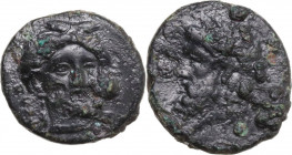 Sicily. Gela. AE 14 mm, 4th century BC. Obv. Head of Demeter facing slightly right, wearing wreath of grain. Rev. Head of Gelas left, horned, wearing ...