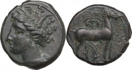 Punic Sardinia. AE 16 mm. c. 360-330 BC, uncertain mint. Obv. Wreathed head of Kore left, wearing triple-pendant earring. Rev. Horse standing right; i...
