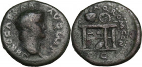 Nero (54-68). AE Semis, 64 AD. Obv. Laureate head right. Rev. Table bearing urn and wreath; on front of left panel, two gryphons standing facing one a...