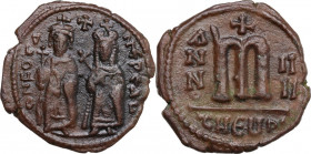 Phocas with Leontia (602-610). AE Follis, Theupolis (Antioch) mint, dated RY 4 (605-606). Obv. Emperor and Empress standing facing. Rev. Large m (mark...
