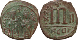 Phocas with Leontia (602-610). AE Follis, Theoupolis (Antioch) mint. Obv. Phocas and Leontia standing facing; the emperor holds globus cruciger, the e...