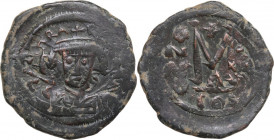 Heraclius (610-641). AE Follis. Constantinople mint, overstruck on previous issue. Obv. Crowned, draped, and cuirassed bust facing, holding globus cru...
