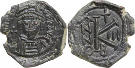 Heraclius (610-641). AE Half Follis, Nicomedia mint, dated RY 3 (612-613). Obv. Helmeted, draped and cuirassed bust facing, holding short cross. Rev. ...