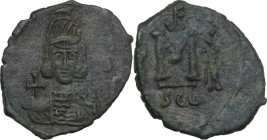 Constantine IV Pogonatus, with Heraclius and Tiberius (668-685). AE Follis, Syracuse mint. Struck 668-674 AD. Obv. Helmeted and cuirassed facing bust,...