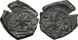 Manuel I Comnenus (1143-1180). AE Tetarteron, Thessalonica mint. Obv. Cross with X at center set on three steps. Rev. Half-length figure of Manuel I s...