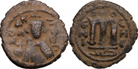 The Umayyad Caliphate. Arab-byzantine, pre-reform coinage. AE Fals, Emesa mint, 41-77 H / 661-697 AD. D/ Facing bust of Byzantine emperor, holding glo...