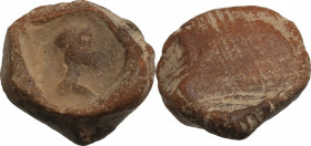 Roman terracotta seal/bulla for papyrus scroll with head right. 1st-3rd century AD. 1.90 g. 17.70 mm. VF.