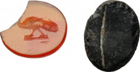 Lot of two (2) gems: orange carnelian intaglio with figure of peacock advancing left; dark vitreous paste intaglio. Roman, 1st-3rd century AD. 8.5 x 7...
