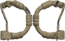 Bronze fibula, bow shaped with geometric embellishments. Roman. 16 mm.