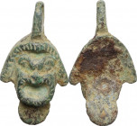 Bronze pendant in the shape of a theater mask. Roman period. 40 mm with the original loop.