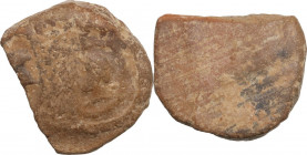 Terracotta seal depicting a female (?) head left. Greek or Roman. 2.80 g. 22.00 mm.