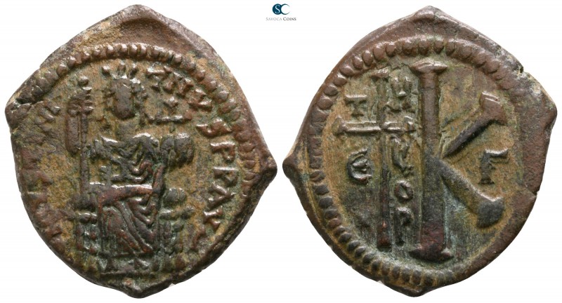 Justinian I. AD 527-565. Theoupolis (Antioch)
Half follis Æ

27mm., 9,43g.
...