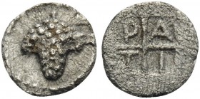 MACEDON. Tragilos . Circa 450-400 BC. Tetartemorion (Silver, 6 mm, 0.17 g, 9 h). Grape bunch. Rev. TPAI within quarters of quadripartite incuse square...