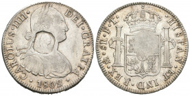 Charles IV (1788-1808). 8 reales. 1802. Mexico. FT. (Cal-975). (Km-656). Ag. 26,89 g. Octagonal (counterfeit) countermark with the bust of George III....