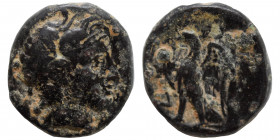 GREEK. Ae (bronze, 1.26 g, 13 mm). Bust of Apollo (?) right. Rev. Eagle standing to left. Fine.