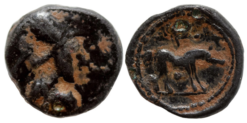 Uncertain. Ae (bronze, 0.74 g, 11 mm). Athena (?) to right. Rev. Horse (?) to le...