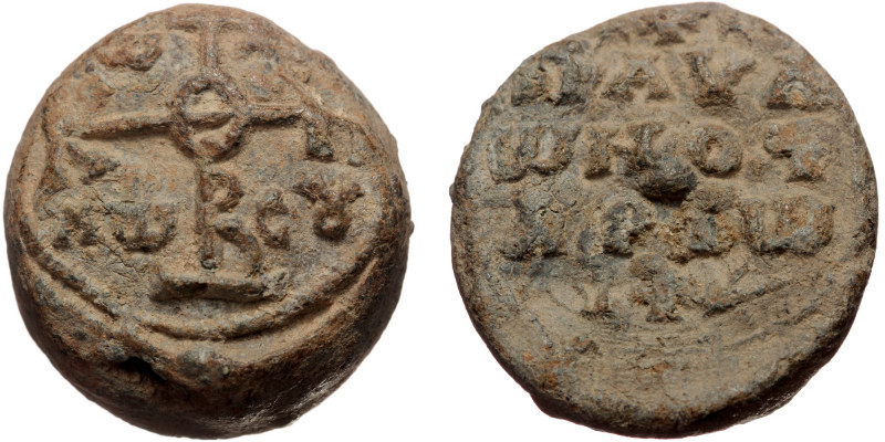 Byzantine seal (Lead, 23,3 mm, 18,68 g). Obv: Legend in three lines, between two...