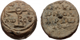 Byzantine seal (Lead, 23,3 mm, 18,68 g). Obv: Legend in three lines, between two crosses. 
Rev: Cruciform invocative monogram, letters in fields.