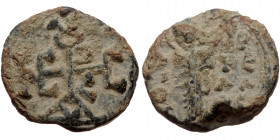 Byzantine seal (Lead, 18,2 mm, 5,71 g). Obv: Uncertain nimbate saint (?) standing facing, letters in fields. 
Rev: Cruciform monogram.