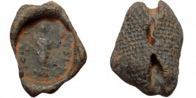 Byzantine seal (Lead, 21,6 mm, 4,59 g). Obv: Uncertain saint (?) standing facing, orans, legend. 
Rev: Textile imprint.