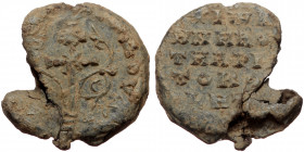 Byzantine seal (Lead, 21,1 mm, 6,36 g), ca. 10th-11th cent. Obv: Legend in five lines. 
Rev: Latin cross with floral branches, legend.
