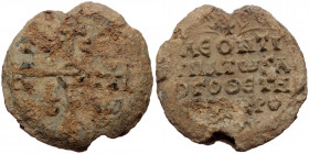 Byzantine seal (Lead, 30,8 mm, 20,31 g). Obv: Legend in four lines. 
Rev: Cruciform invocative monogram, letters in fields.