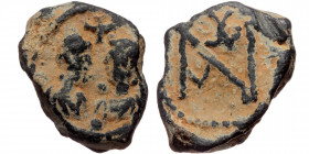 Byzantine seal (Lead, 20,8 mm, 8,86 g), ca. 8th-9 th cent. Obv: Two busts facing each other, cross above.
Rev: Block monogram.