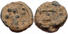 Byzantine seal (Lead, 17,6 mm, 5,60 g). Obv: Uncertain nimbate saint (?) standing facing, cross to right. 
Rev: Cruciform monogram.