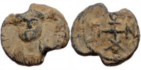 Byzantine seal (Lead, 18,7 mm, 5,00 g). Obv: Bust of Christ (?) facing, letters to left and right. 
Rev: Cruciform monogram.