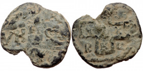 Byzantine seal (Lead, 22,1 mm, 6,20 g). Obv: Legend in lines (?). 
Rev: Legend in cross, letters in fields.
