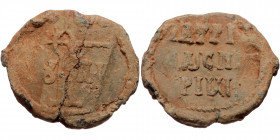 Byzantine seal (Lead, 27,2 mm, 10,63 g). Obv: Legend in three lines. 
Rev: Cruciform monogram.