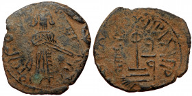 ISLAMIC, Umayyad Caliphate (Arab-Byzantine coinage).end of the C7th and beginning of the 8th century Æ Fals (Bronze, 21mm, 2.10g). 
Obv: Caliph stand...